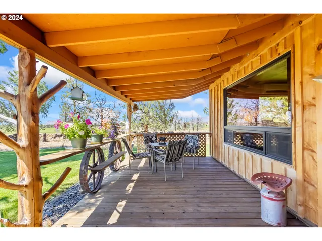 a view of a chairs and table in the patio