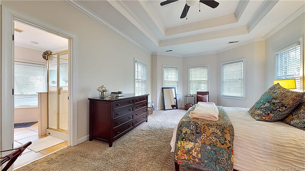 3234 Rhett Butler Place Charlotte, NC 28270 - Photo 11 of 27 a bed room with a bed and a window