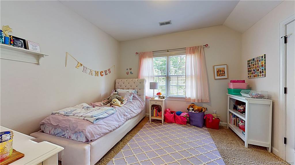 3234 Rhett Butler Place Charlotte, NC 28270 - Photo 15 of 27 a bedroom with a bed and a window