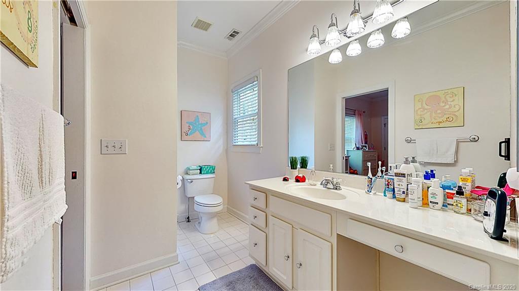 3234 Rhett Butler Place Charlotte, NC 28270 - Photo 19 of 27 a bathroom with a sink a toilet and a mirror