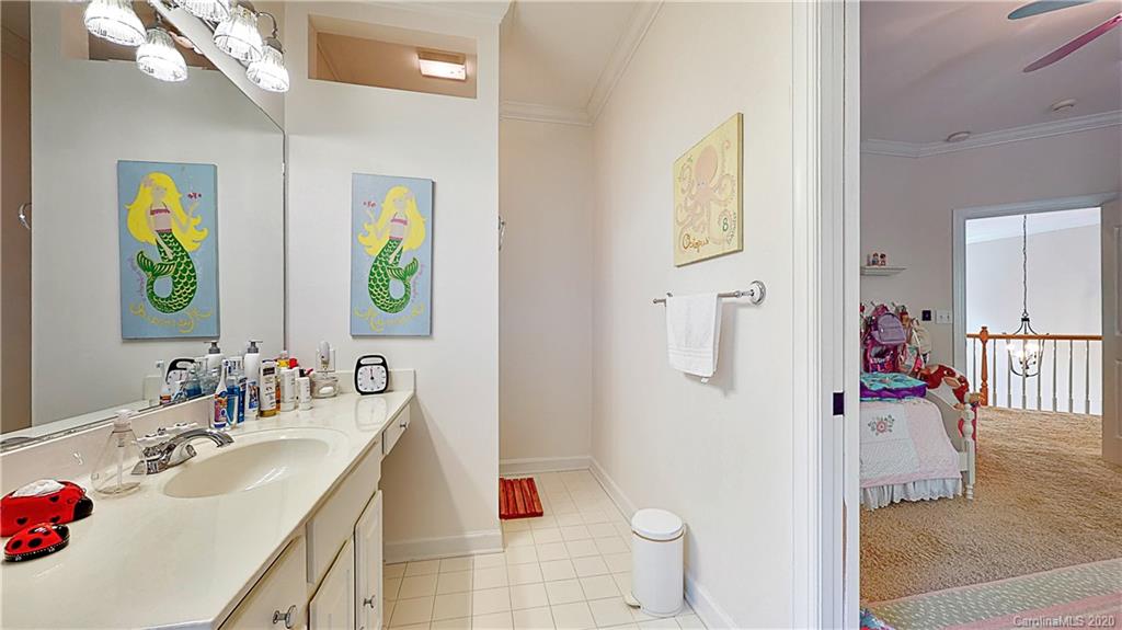 3234 Rhett Butler Place Charlotte, NC 28270 - Photo 20 of 27 a bathroom with a sink vanity mirror and tub