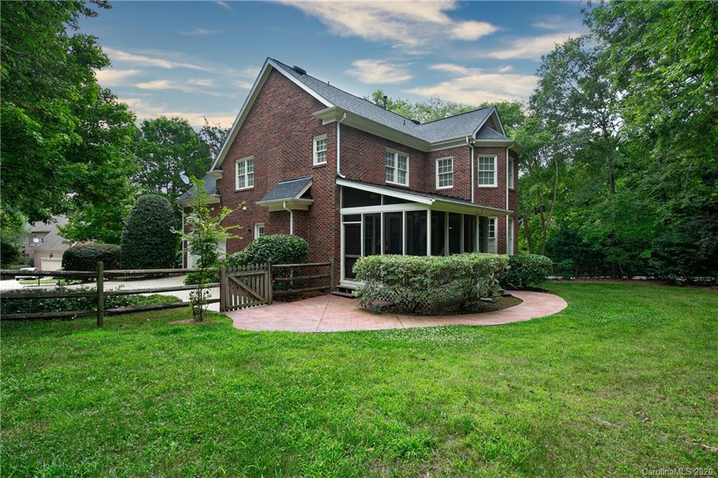 3234 Rhett Butler Place Charlotte, NC 28270 - Photo 24 of 27 a view of a house with a yard and a garden