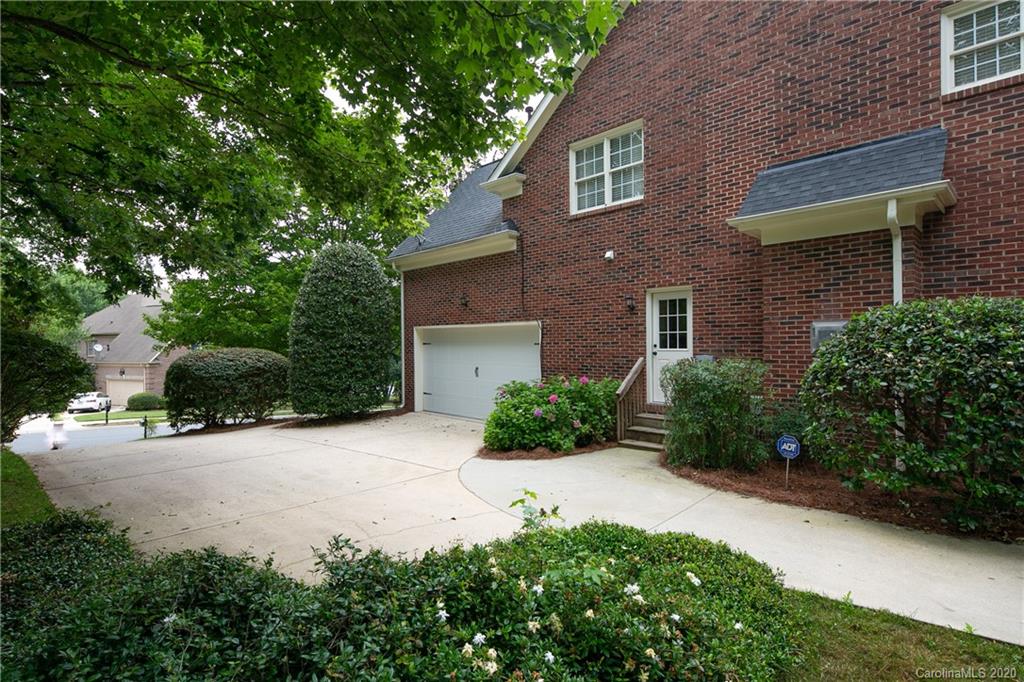 3234 Rhett Butler Place Charlotte, NC 28270 - Photo 27 of 27 a front view of a house with garden