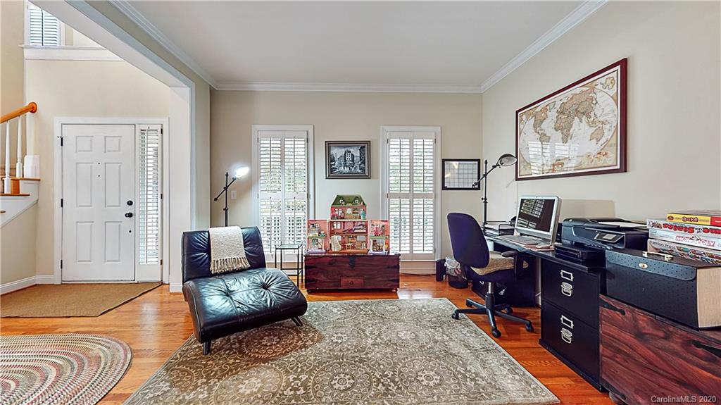 3234 Rhett Butler Place Charlotte, NC 28270 - Photo 5 of 27 a livingroom with workspace and a couch
