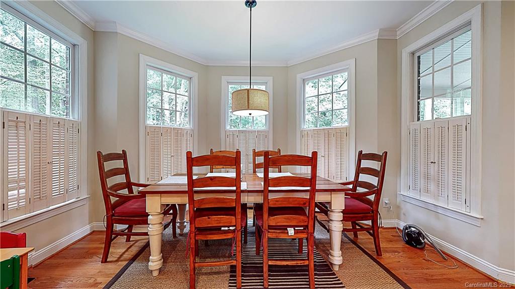 3234 Rhett Butler Place Charlotte, NC 28270 - Photo 7 of 27 a view of a dining room with furniture window and wooden floor