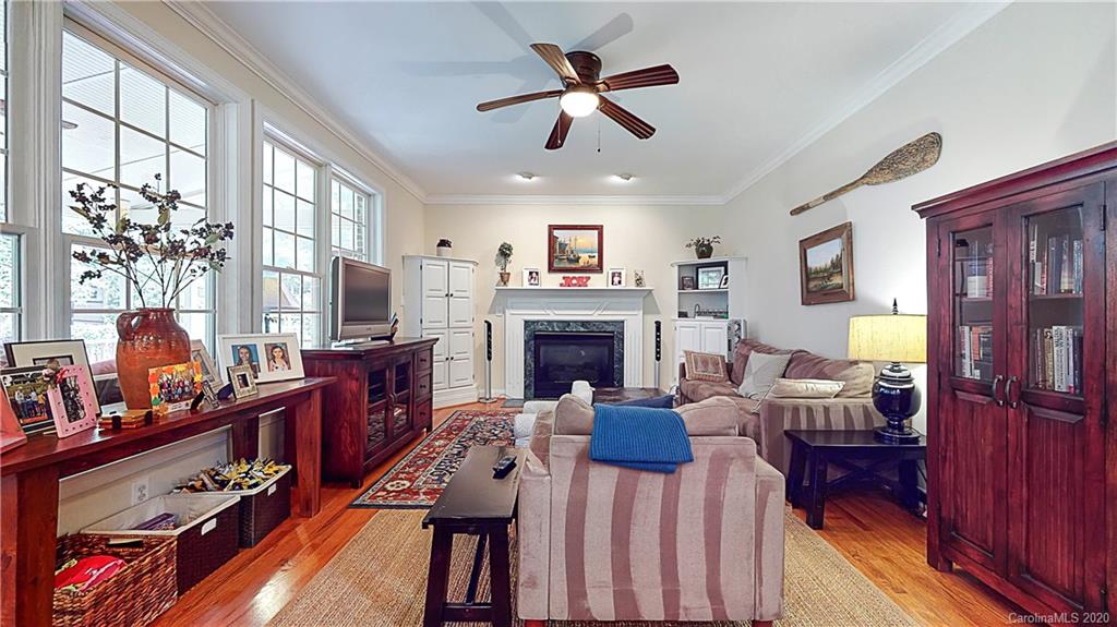 3234 Rhett Butler Place Charlotte, NC 28270 - Photo 8 of 27 a living room with furniture fireplace and a large window