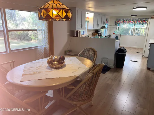 a dining room with furniture and window