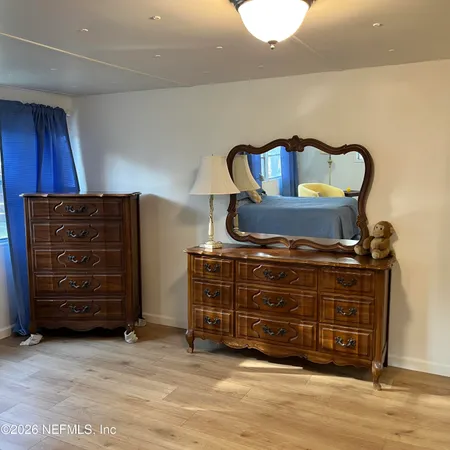 a room with furniture and wooden floor