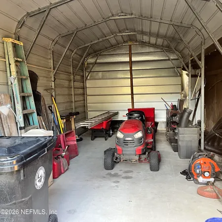 a view of a garage with parked cars