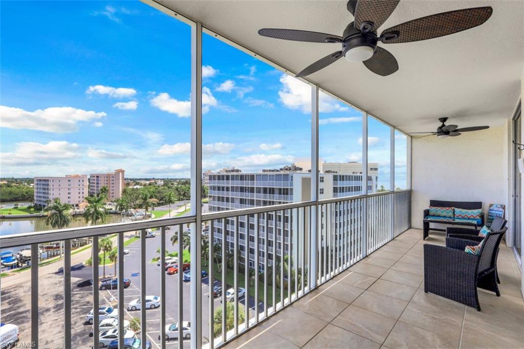 5 Bluebill Avenue, Unit 810 Naples, FL 34108 - Photo 15 of 19 a view of a balcony with furniture