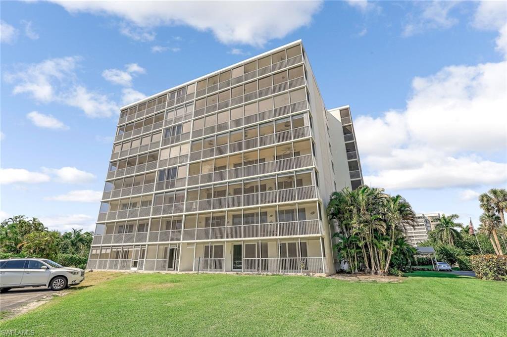 5 Bluebill Avenue, Unit 810 Naples, FL 34108 - Photo 2 of 19 a view of an apartment with a garden