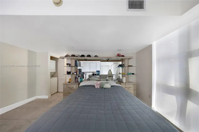 a bed room with a bed and wooden floor