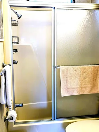 a bathroom with a bathtub and a shower