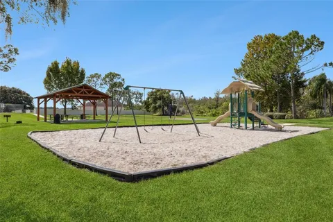 a view of a park with a slide