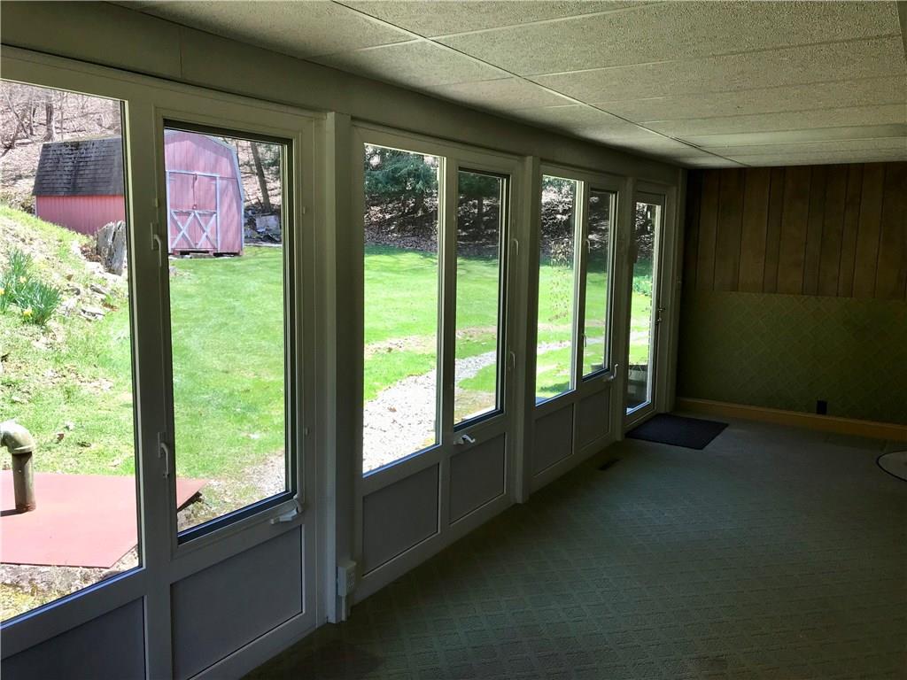 1180 Kunkle Road Creekside, PA 15732 - Photo 14 of 25 Huge heated back porch off kitchen overlooking the backyard. 25' x 7'6"