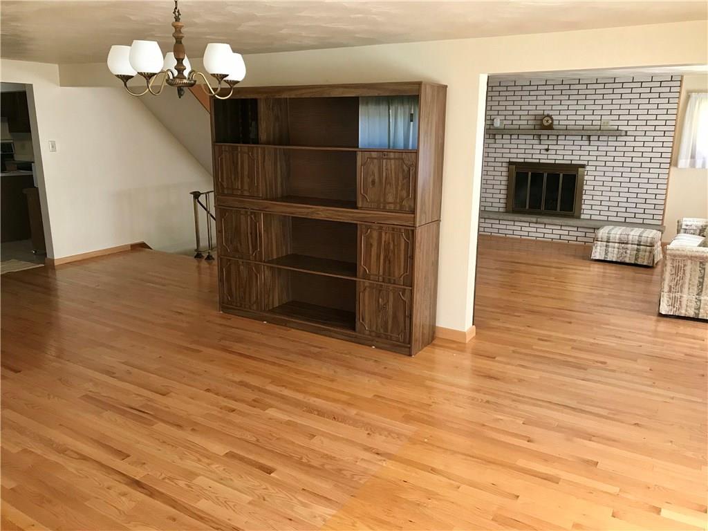 1180 Kunkle Road Creekside, PA 15732 - Photo 7 of 25 Open plan, hardwood flooring, wood burning fireplace.