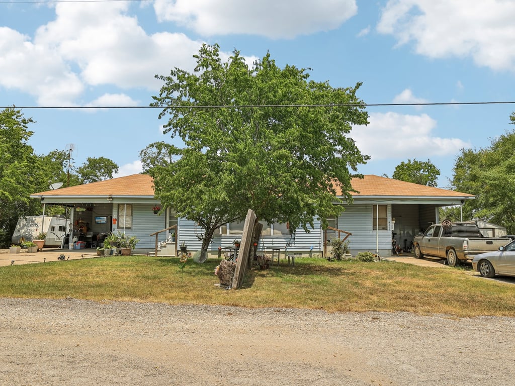Tbd Tbd Bluebonnet Road Lockhart, TX 78644 - Photo 12 of 20 a front view of a house with a yard