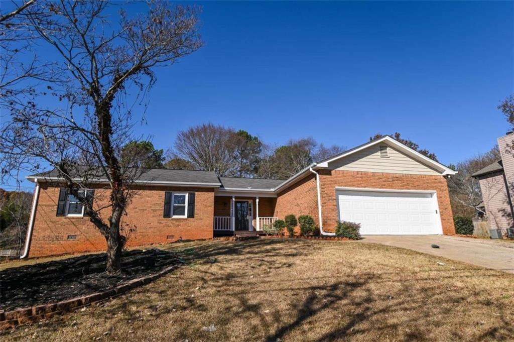 1735 Ridgeway Drive Lawrenceville, GA 30044 - Photo 1 of 1 a front view of a house with a yard