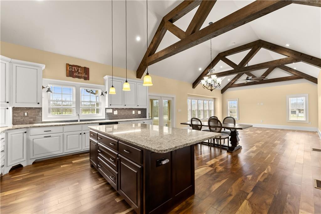 725 County Farm Road Jefferson, GA 30549 - Photo 21 of 66 a kitchen with a stove a sink dishwasher and a stove with wooden floor