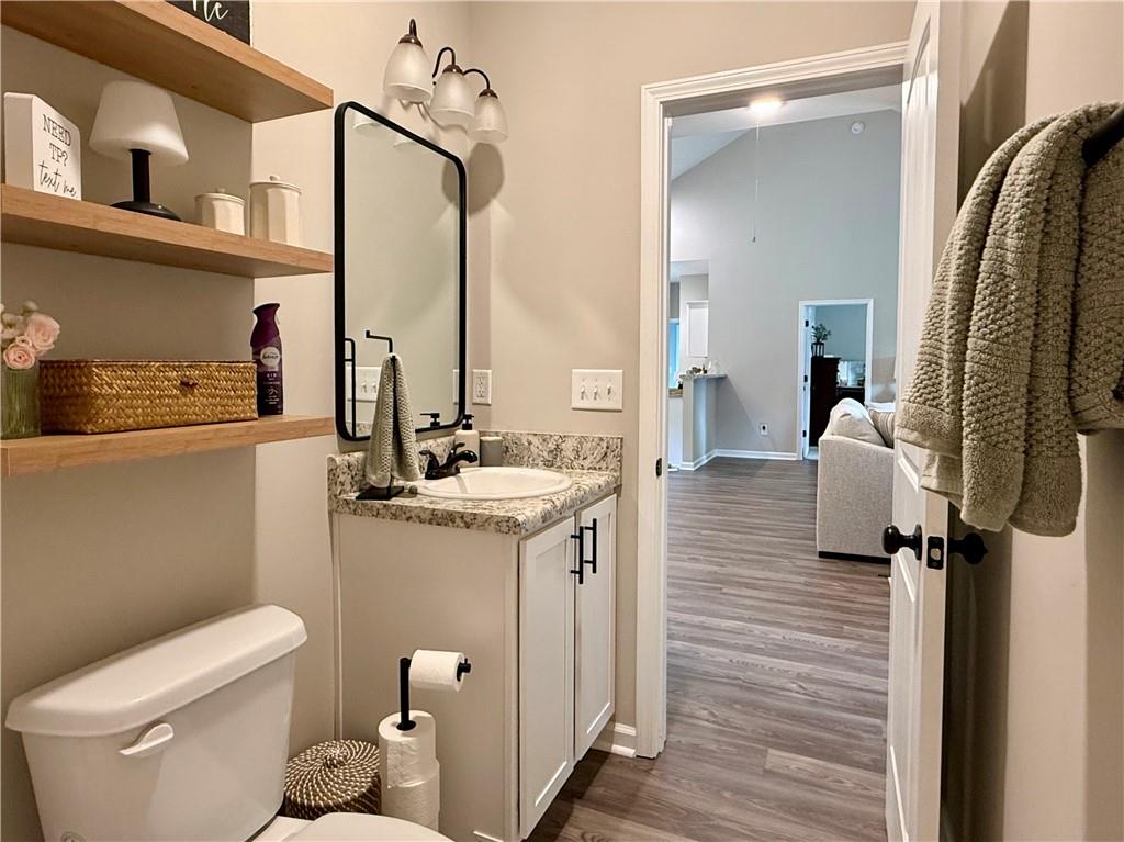 1776 Pleasant Grove Road Temple, GA 30179 - Photo 26 of 45 a bathroom with a granite countertop sink toilet and mirror