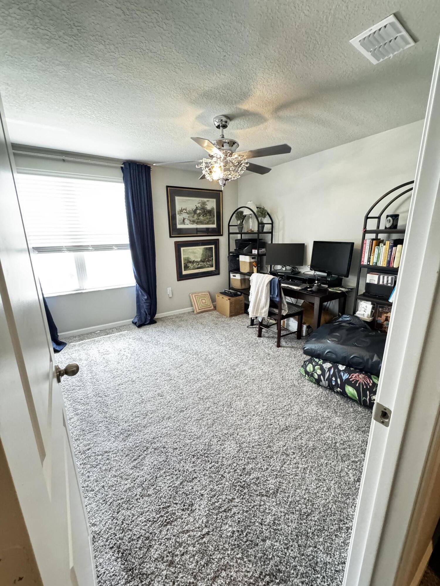 5646 Southeast Edgewater Circle Stuart, FL 34997 - Photo 20 of 20 a view of a livingroom with furniture and a window