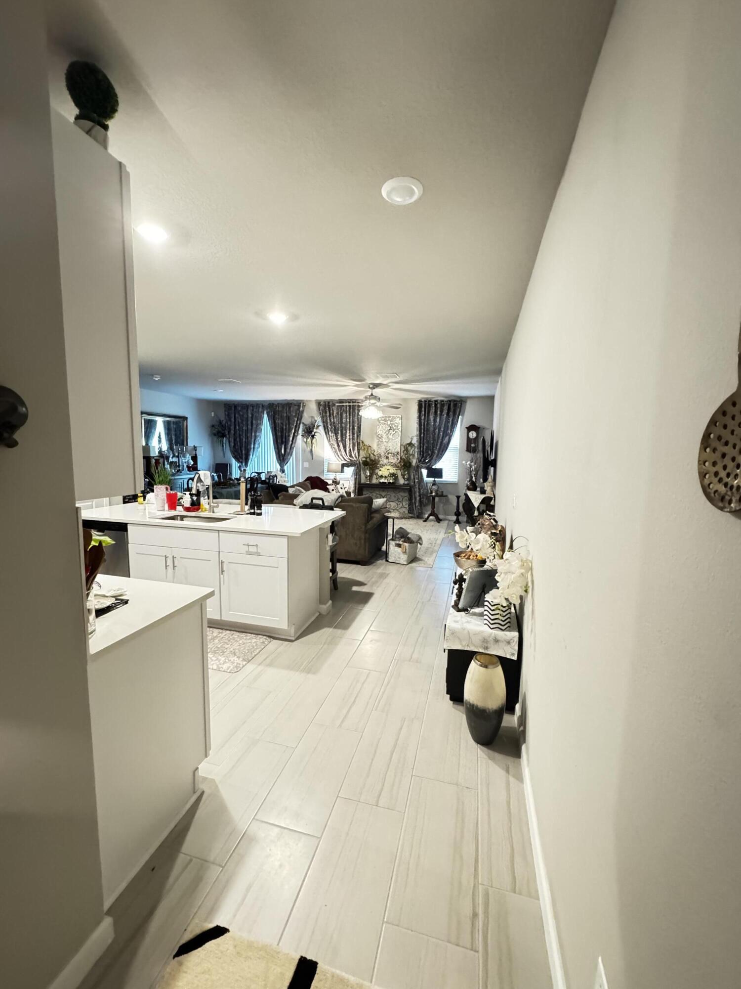 5646 Southeast Edgewater Circle Stuart, FL 34997 - Photo 2 of 20 a kitchen with a sink storage and utility