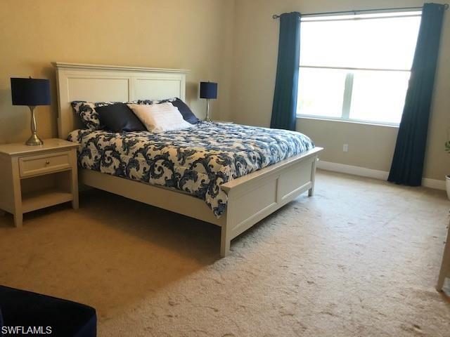 20085 Larino Loop Estero, FL 33928 - Photo 11 of 18 a bedroom with a bed and window