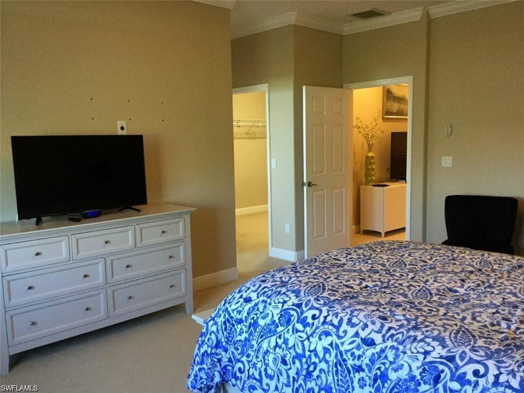 20085 Larino Loop Estero, FL 33928 - Photo 14 of 18 a bedroom with a bed and flat screen tv