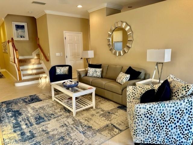 20085 Larino Loop Estero, FL 33928 - Photo 4 of 18 a bed room with a bed and a couch