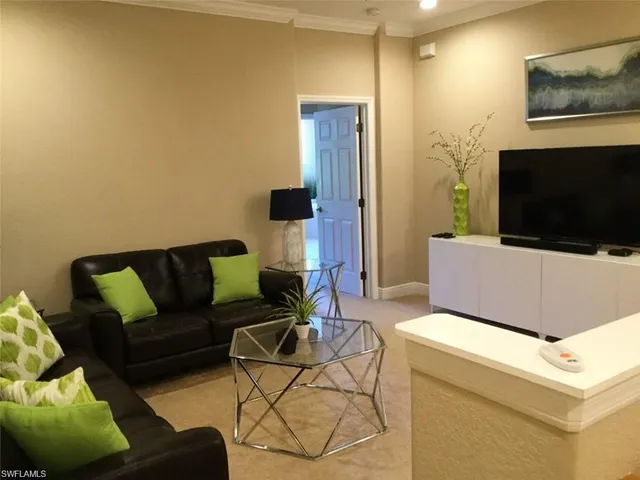 a living room with a couch and a flat screen tv