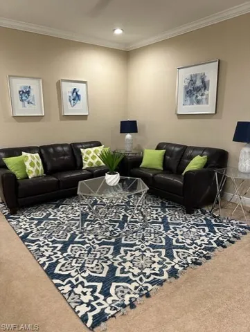 a living room with furniture and a rug