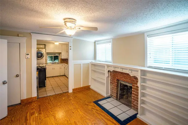 a bedroom with a bed and a fireplace