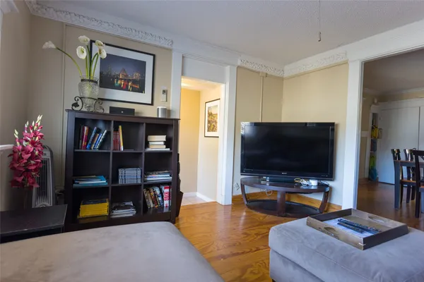 a living room with furniture and a flat screen tv