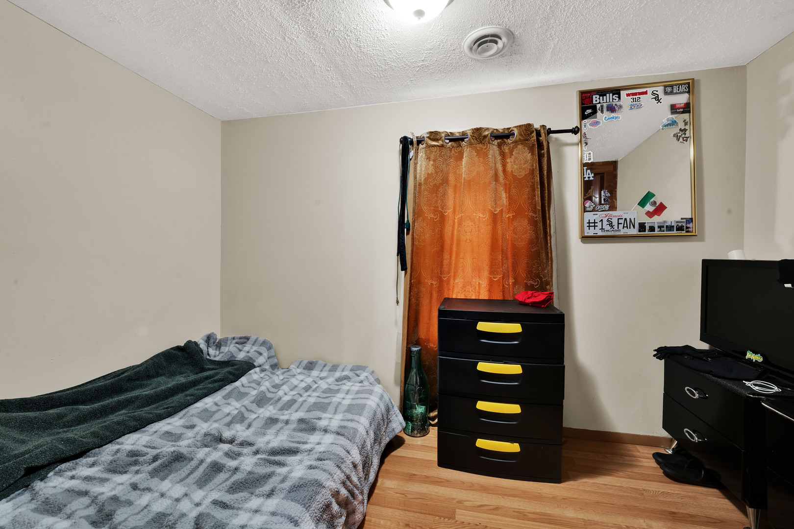 1404 West Fuller Street Chicago, IL 60608 - Photo 11 of 17 a bedroom with a bed and a television