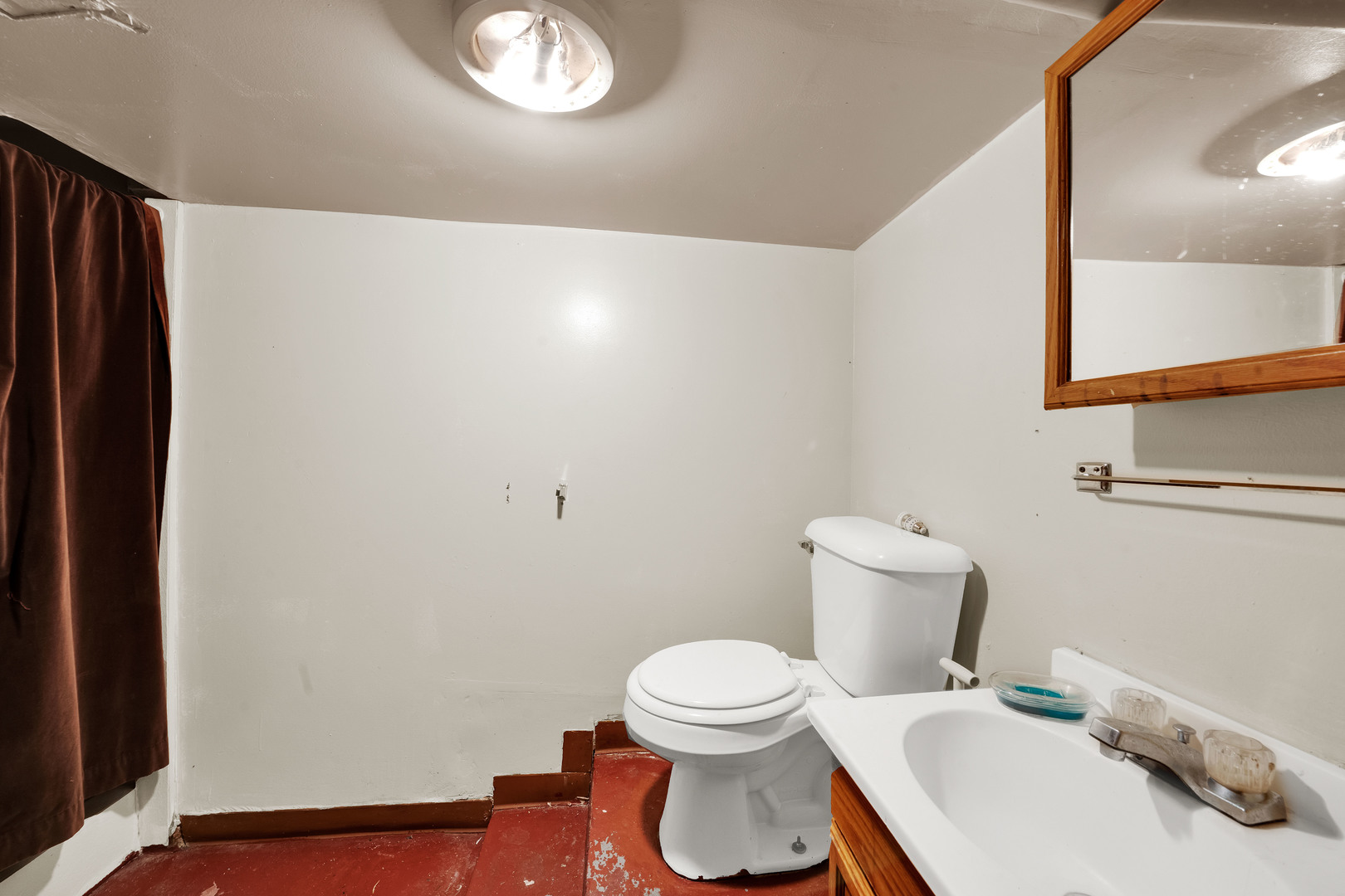 1404 West Fuller Street Chicago, IL 60608 - Photo 17 of 17 a white toilet sitting next to a bathroom sink