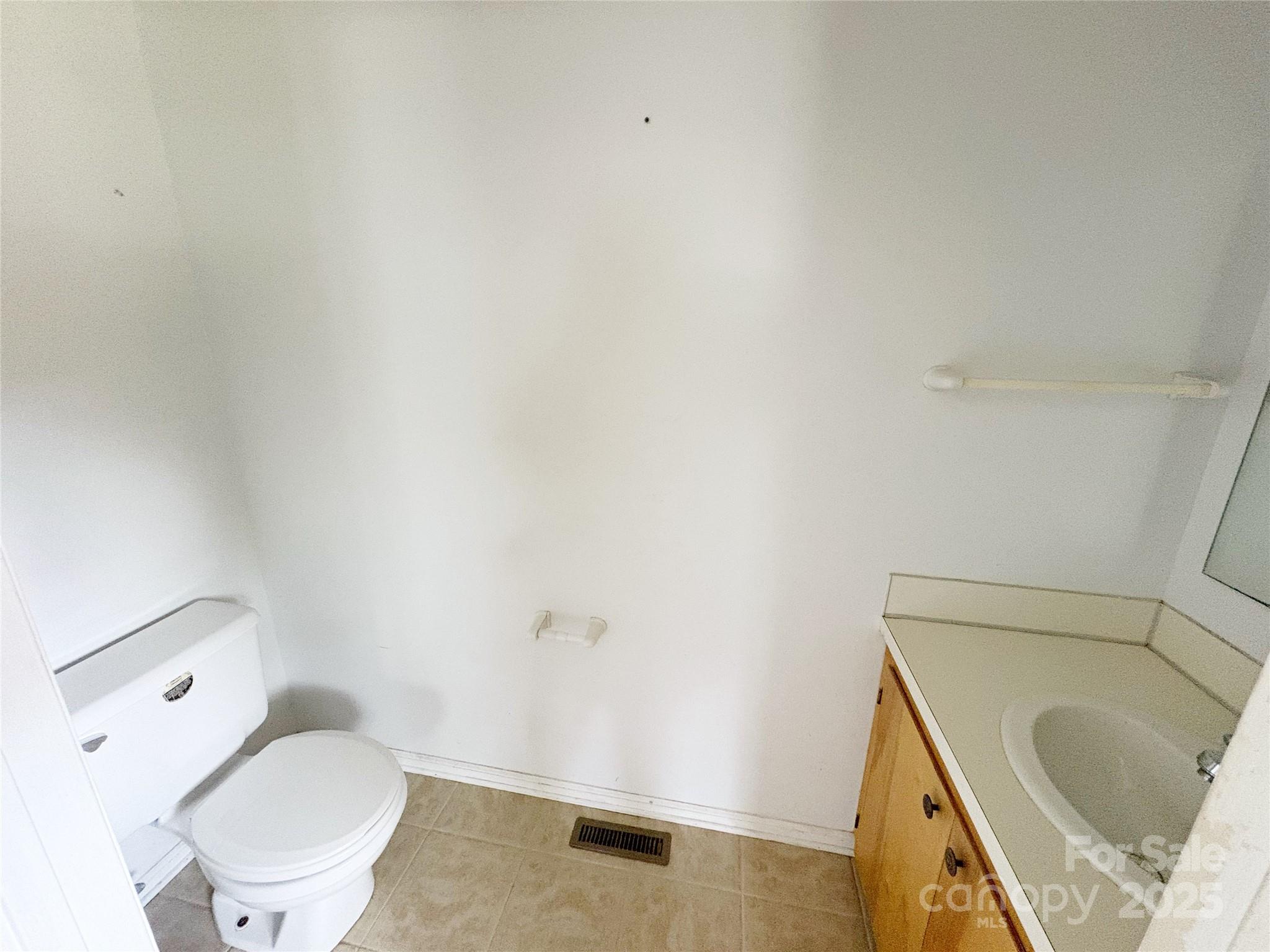 335 Plank Road Wadesboro, NC 28170 - Photo 11 of 14 a bathroom with a sink and a toilet