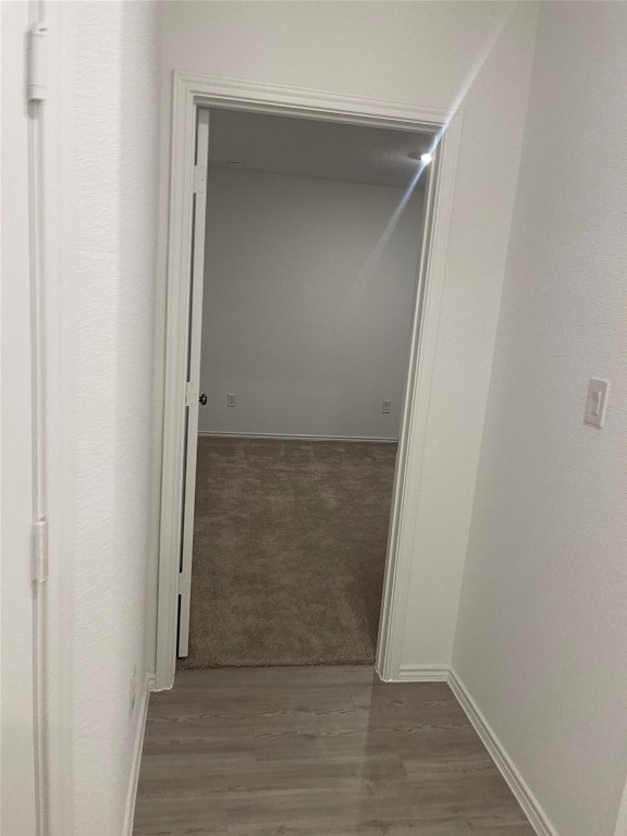 169 Sormonne Loop Kyle, TX 78640 - Photo 6 of 11 an empty room with wooden floor