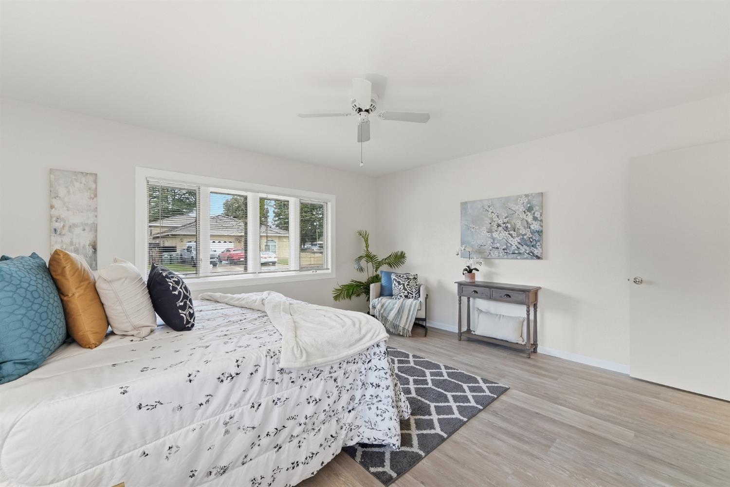 1344 Magnolia Avenue Modesto, CA 95350 - Photo 31 of 71 a bedroom with a large bed and a window