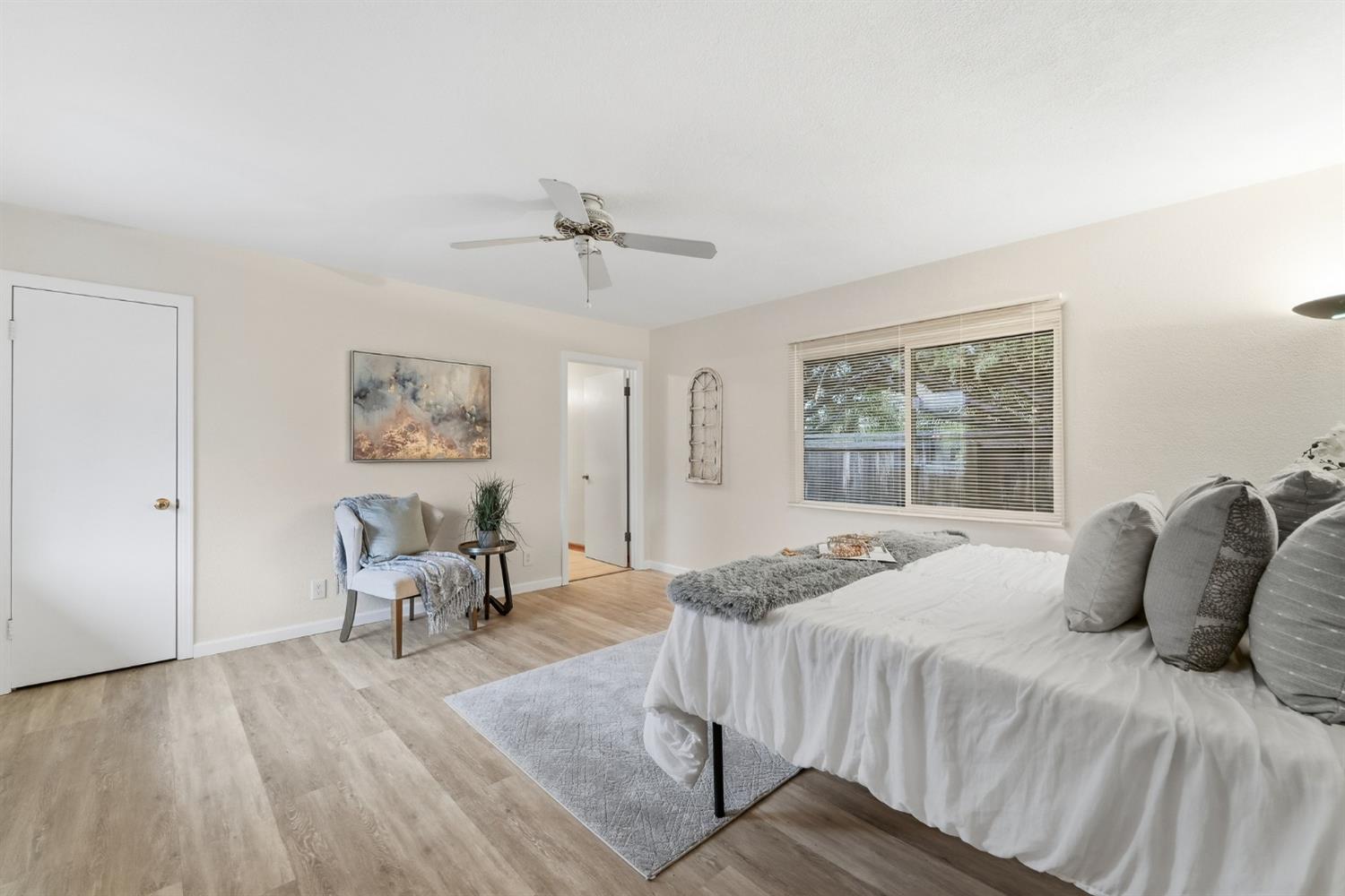 1344 Magnolia Avenue Modesto, CA 95350 - Photo 37 of 71 a bedroom with a bed and a chandelier