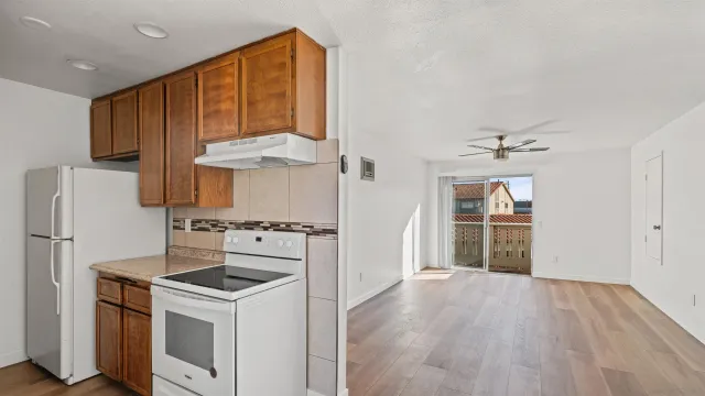a kitchen with a stove and a refrigerator