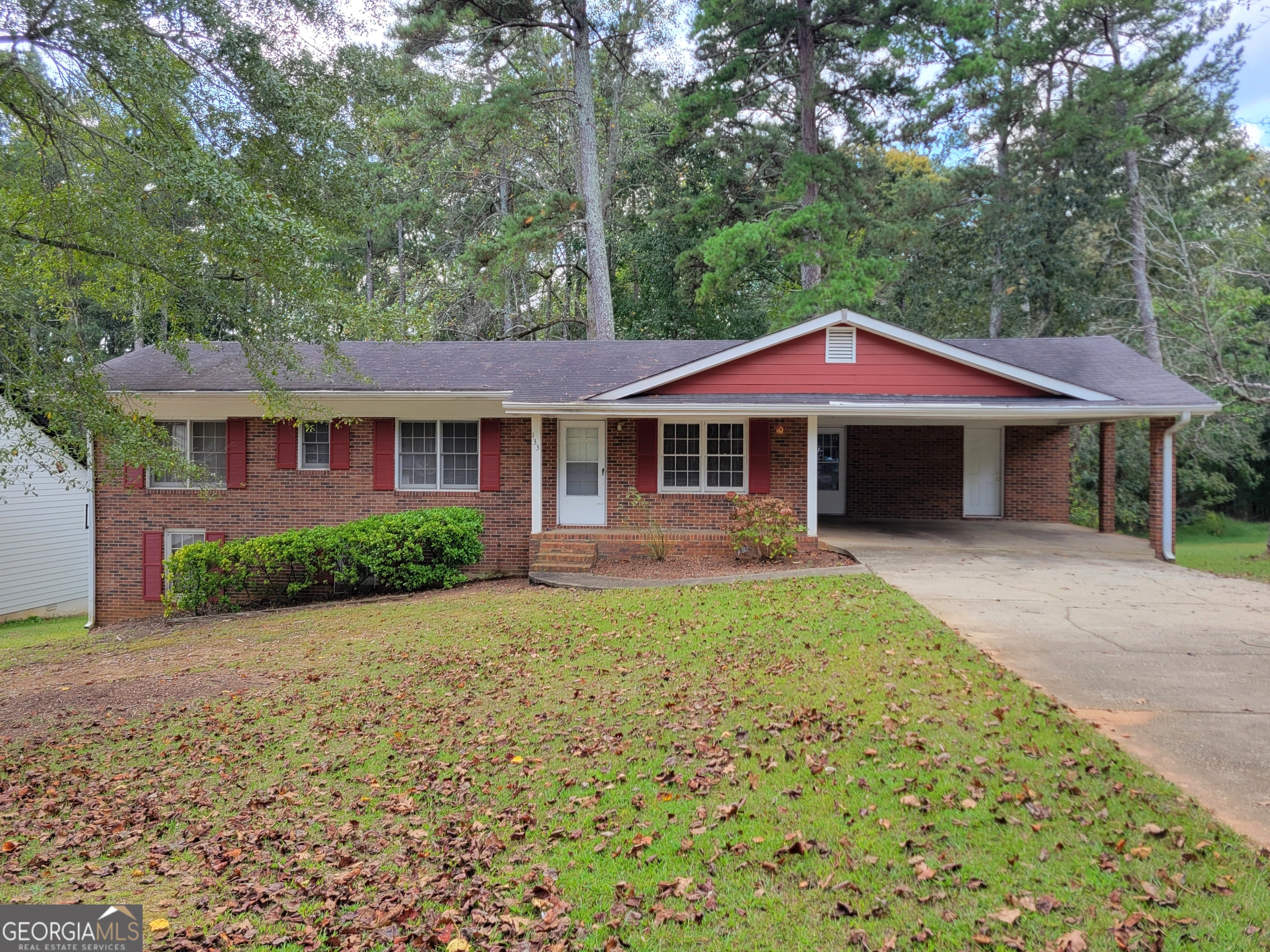133 Plantation Road Winder, GA 30680 - Photo 1 of 13 a front view of a house with yard and green space
