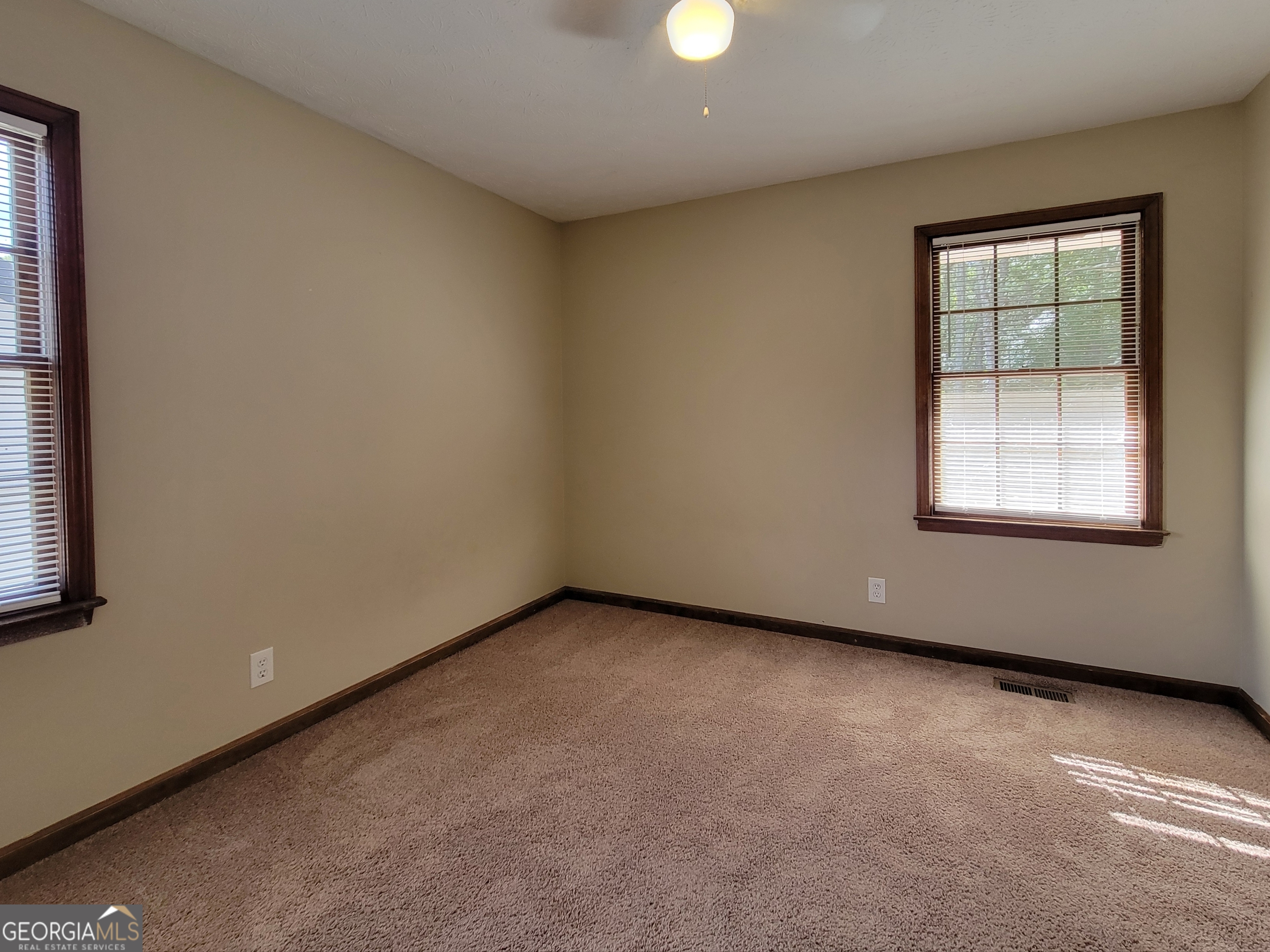 133 Plantation Road Winder, GA 30680 - Photo 12 of 13 an empty room with a window