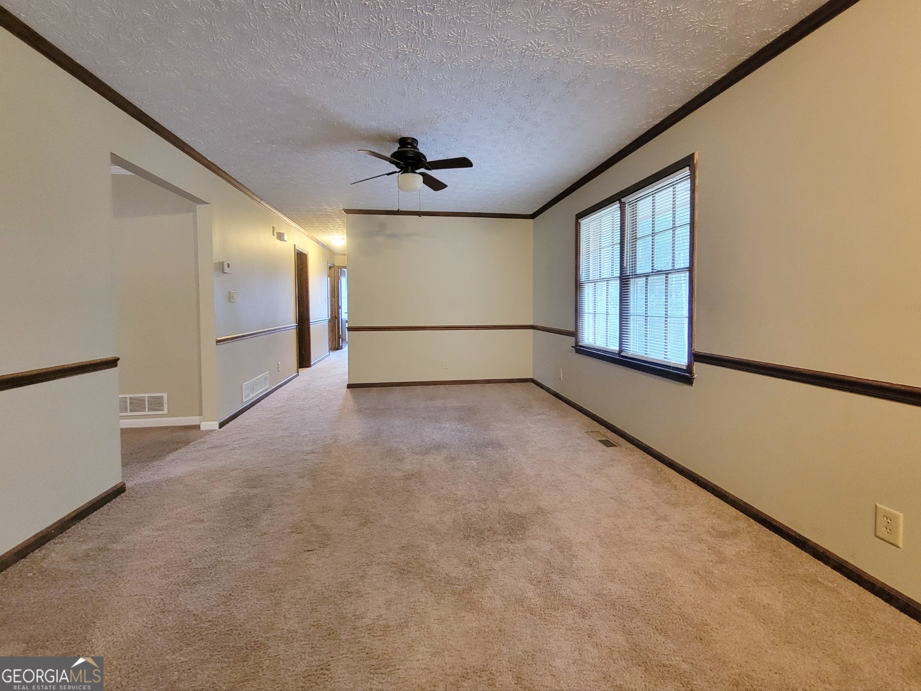 133 Plantation Road Winder, GA 30680 - Photo 3 of 13 a view of an empty room with a window