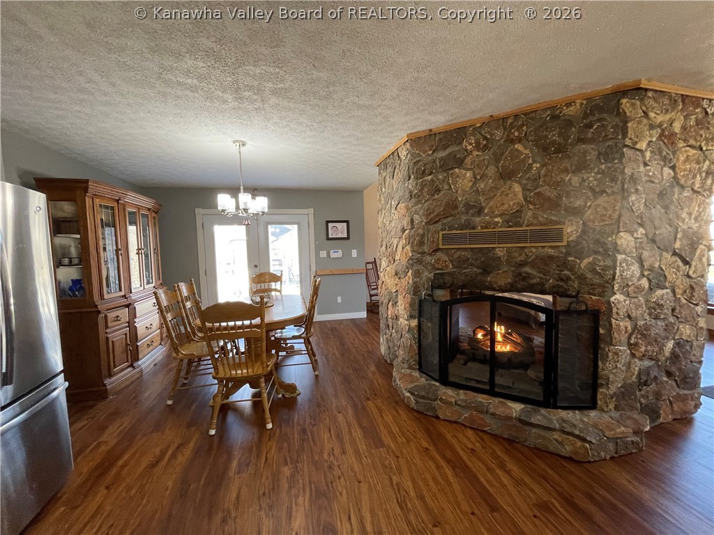 4254 Greer Road Point Pleasant, WV 25550 - Photo 9 of 46 Dining room with fireplace that also opens into Living room