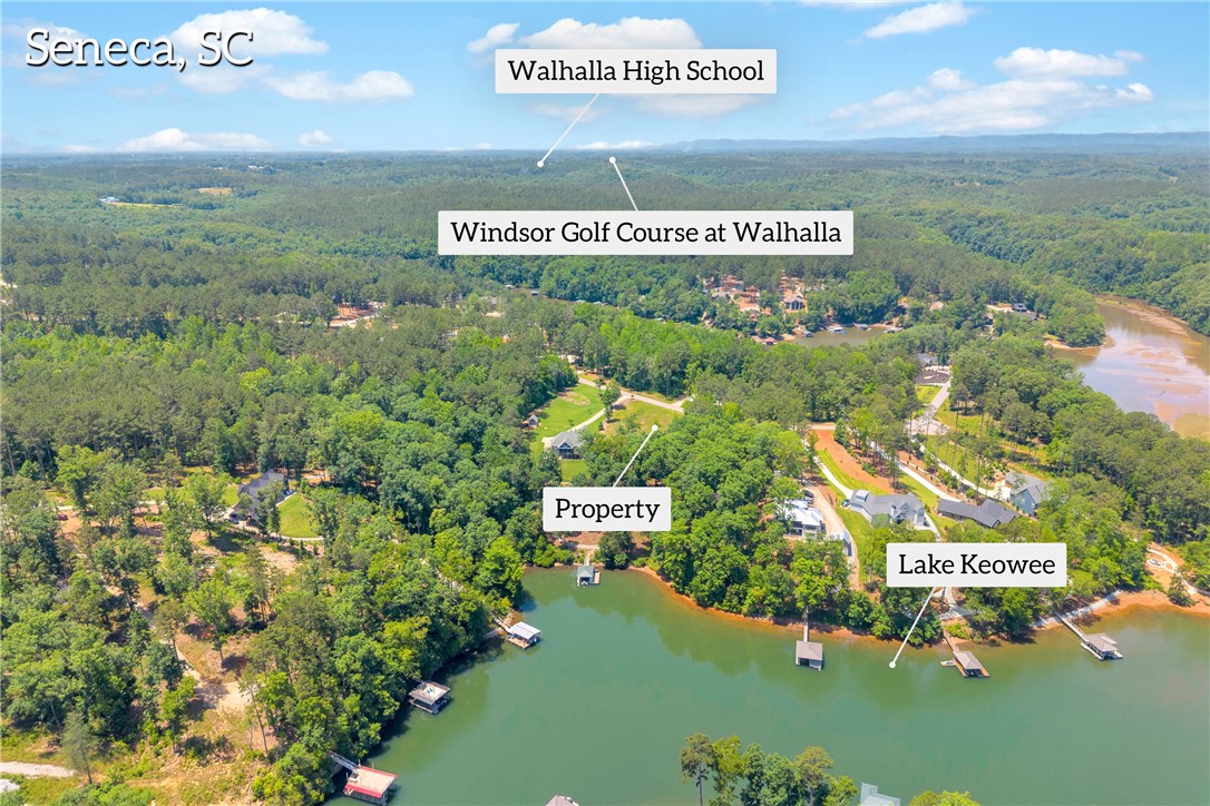 Lot 60 Harbor Point Seneca, SC 29672 - Photo 13 of 30 Lush woodlands embrace this lakeside property, offering private access to tranquil waters.