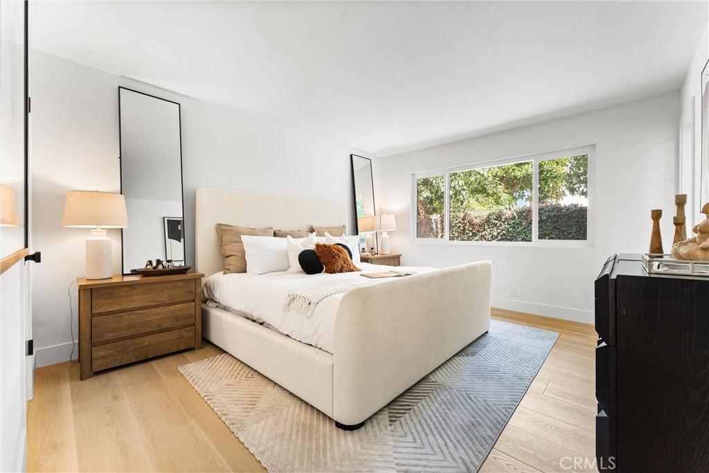 3621 Myrtle Street Irvine, CA 92606 - Photo 24 of 40 a living room with a bed furniture and a large window