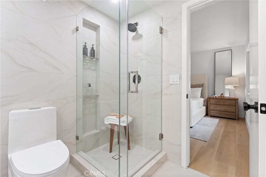 3621 Myrtle Street Irvine, CA 92606 - Photo 30 of 40 a bathroom with a toilet a sink and shower