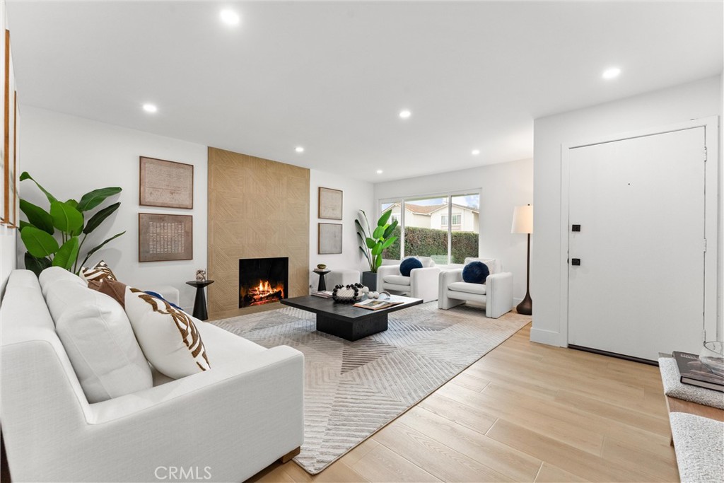 3621 Myrtle Street Irvine, CA 92606 - Photo 4 of 40 a living room with furniture and a fireplace