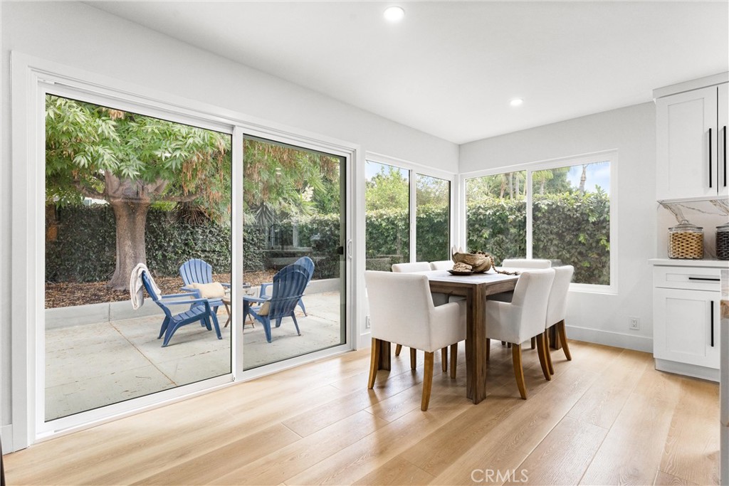 3621 Myrtle Street Irvine, CA 92606 - Photo 8 of 40 a dining room with furniture large windows and wooden floor
