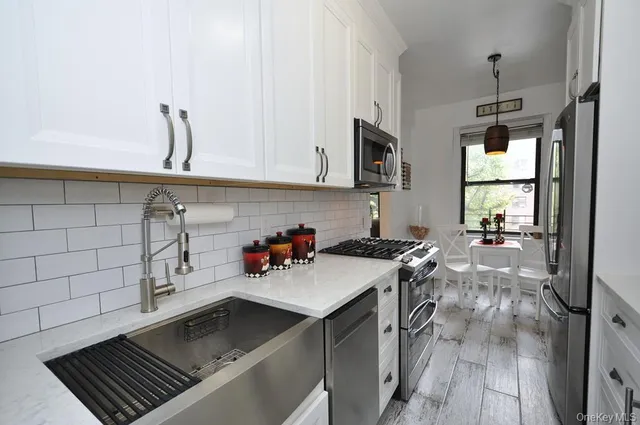 a view of a dining room with furniture and window